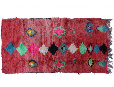Vintage Boucherouite rug with red background and black and white neon green blue pink lozenges