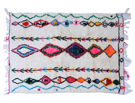 White Berber carpet with small pink, green, red and blue diamonds