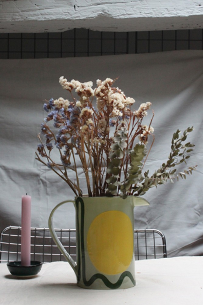 Handmade ceramic pitcher in mint green and yellow colors, made in France.