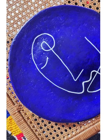 Decorative blue ceramic plate handcrafted in Tunisia.